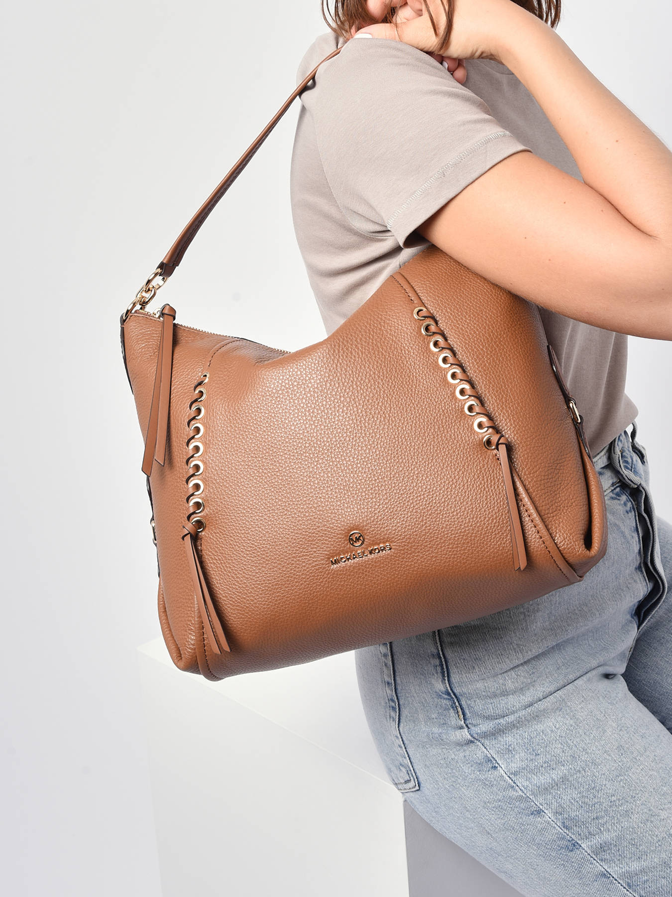 Buy Michael Kors Women brown sling bag Online - 664810 | The Collective